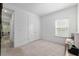 Bedroom with large closet, desk, and view of the backyard at 1119 Se 42Nd Rd, Ocala, FL 34480