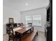 Spacious dining room with a long wooden table, bench seating, and classic decor, perfect for Gathering gatherings at 1119 Se 42Nd Rd, Ocala, FL 34480