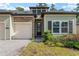 Charming single-Gathering home featuring a one-car garage, well-manicured lawn, and stone architectural details at 1119 Se 42Nd Rd, Ocala, FL 34480