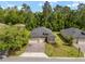 Charming single-Gathering home featuring a three-car garage and a well-manicured lawn at 1119 Se 42Nd Rd, Ocala, FL 34480