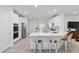 Modern kitchen featuring white cabinets, stainless steel appliances, and a breakfast bar with seating at 1119 Se 42Nd Rd, Ocala, FL 34480
