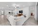 Spacious living room featuring an open floor plan, comfortable seating, and access to the kitchen at 1119 Se 42Nd Rd, Ocala, FL 34480