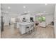 Open concept living space featuring a kitchen island with seating and a spacious living room at 1119 Se 42Nd Rd, Ocala, FL 34480