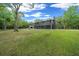 Scenic view of a property with lush green lawn and an appealing two-story home at 11311 Ne 40Th Street Rd, Silver Springs, FL 34488