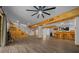 Spacious basement with hardwood floors, a wood staircase, and bar, perfect for relaxing and entertaining at 11311 Ne 40Th Street Rd, Silver Springs, FL 34488