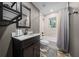 Modern bathroom featuring a new vanity, elegant fixtures, and a stylish shower and tub at 11311 Ne 40Th Street Rd, Silver Springs, FL 34488