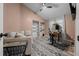 Home office/bedroom with a closet, ceiling fan, desk, and a comfortable seating area at 11311 Ne 40Th Street Rd, Silver Springs, FL 34488