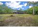 Expansive property with a beautiful home, surrounded by lush greenery and clear blue skies at 11311 Ne 40Th Street Rd, Silver Springs, FL 34488