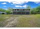 Well-kept home with a spacious backyard, showcasing a clean exterior and tidy landscape at 11311 Ne 40Th Street Rd, Silver Springs, FL 34488