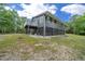 Elegant home featuring a spacious screened-in lower level and private balcony overlooking the grounds at 11311 Ne 40Th Street Rd, Silver Springs, FL 34488