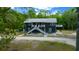 Charming two-story home with a welcoming entrance and scenic surroundings at 11311 Ne 40Th Street Rd, Silver Springs, FL 34488