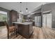 Modern kitchen featuring custom cabinets, stainless steel appliances and a center island at 11311 Ne 40Th Street Rd, Silver Springs, FL 34488