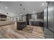 Open-concept kitchen featuring an island, modern appliances, and stylish flooring at 11311 Ne 40Th Street Rd, Silver Springs, FL 34488