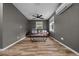Cozy living room with hardwood floors, a ceiling fan, and a comfortable brown sofa at 11311 Ne 40Th Street Rd, Silver Springs, FL 34488
