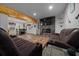 Basement living room featuring a stone fireplace, entertainment area, and adjacent dining space at 11311 Ne 40Th Street Rd, Silver Springs, FL 34488