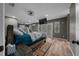 Spacious main bedroom features a ceiling fan, ensuite bath, and access to a private balcony at 11311 Ne 40Th Street Rd, Silver Springs, FL 34488
