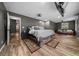 Spacious main bedroom features a seating area, ceiling fan, and ensuite bath at 11311 Ne 40Th Street Rd, Silver Springs, FL 34488