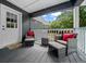 Relaxing porch featuring comfortable seating area with decorative cushions and 'Home' welcome mat at 11311 Ne 40Th Street Rd, Silver Springs, FL 34488