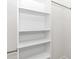 This closet has four shelves and two metal clothing rods at 11415 Nw 15Th St, Ocala, FL 34482