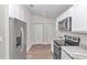 Bright kitchen with stainless steel appliances, stone countertops, and modern finishes at 11415 Nw 15Th St, Ocala, FL 34482