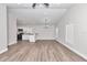 An open-concept living space that features modern hardwood floors and bright, neutral colors at 11415 Nw 15Th St, Ocala, FL 34482