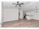 Bright, open-concept living area with modern ceiling fan, hardwood floors, and lots of light at 11415 Nw 15Th St, Ocala, FL 34482
