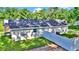 Rear exterior showcasing the home's layout, fresh landscaping, and privacy fence at 11415 Nw 15Th St, Ocala, FL 34482