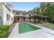 Expansive backyard features a sparkling pool and a charming pergola, perfect for outdoor entertaining at 1251 Sw 43Rd Pl, Ocala, FL 34471