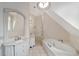 Modern bathroom with a soaking tub, dual sinks, and ample natural light at 1251 Sw 43Rd Pl, Ocala, FL 34471