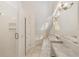 Bright bathroom featuring a marble countertop vanity, bathtub, and a glass-door shower at 1251 Sw 43Rd Pl, Ocala, FL 34471