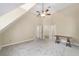Bedroom featuring a ceiling fan, multiple doors, and a table at 1251 Sw 43Rd Pl, Ocala, FL 34471