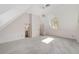 Bright bedroom featuring vaulted ceilings, neutral carpeting, and an ensuite bathroom at 1251 Sw 43Rd Pl, Ocala, FL 34471