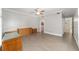 Bright bedroom featuring neutral walls, tile flooring, and traditional wood dresser at 1251 Sw 43Rd Pl, Ocala, FL 34471
