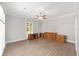 Spacious bedroom featuring wood floors, ceiling fan, and natural light at 1251 Sw 43Rd Pl, Ocala, FL 34471