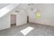 Spacious bedroom featuring vaulted ceilings, neutral carpeting, and a modern light fixture at 1251 Sw 43Rd Pl, Ocala, FL 34471