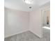 Bedroom with neutral walls and carpeting with an open doorway to the ensuite bathroom at 1251 Sw 43Rd Pl, Ocala, FL 34471