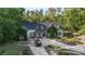 Impressive home featuring a circular driveway, lush landscaping, and classic architectural design at 1251 Sw 43Rd Pl, Ocala, FL 34471