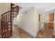 Hallway with a spiral staircase and terra cotta tiled floors at 1251 Sw 43Rd Pl, Ocala, FL 34471