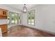 Sunny breakfast area with bay window and terra cotta tiled floors at 1251 Sw 43Rd Pl, Ocala, FL 34471