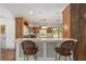 Spacious kitchen with custom cabinetry, a center island, and a breakfast bar with seating at 1251 Sw 43Rd Pl, Ocala, FL 34471