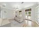 Cozy living room boasting hardwood floors, French doors, and soft natural light at 1251 Sw 43Rd Pl, Ocala, FL 34471
