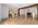 Bright and open living space with a breakfast bar and hardwood floors, adjoining other living areas at 1251 Sw 43Rd Pl, Ocala, FL 34471