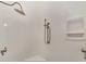 Shower featuring mounted shower head, handheld wand, corner shelf and grab bars at 1251 Sw 43Rd Pl, Ocala, FL 34471