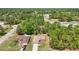 An aerial view of a single-Gathering home in a wooded residential neighborhood at 13173 Sw 65Th Cir, Ocala, FL 34473