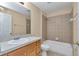 Bathroom featuring tiled shower, bathtub, and vanity at 13173 Sw 65Th Cir, Ocala, FL 34473