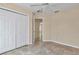 Bright bedroom with tile floors, ceiling fan, and closet at 13173 Sw 65Th Cir, Ocala, FL 34473