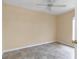 A bright bedroom space is enhanced by tile flooring and a ceiling fan at 13173 Sw 65Th Cir, Ocala, FL 34473