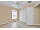 This bedroom features tile flooring and a window for natural light at 13173 Sw 65Th Cir, Ocala, FL 34473