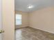 Bright bedroom featuring tile flooring and window providing natural light at 13173 Sw 65Th Cir, Ocala, FL 34473
