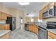 Modern kitchen features stainless steel appliances and granite countertops at 13173 Sw 65Th Cir, Ocala, FL 34473